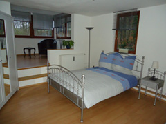 Schlafzimmer mit Sitzecke